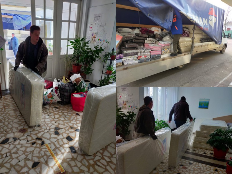 ansporting mattresses, blankets and bed linen provided by LIBERTY Galati to one of the shelters arranged in a secondary school sports hall. 
